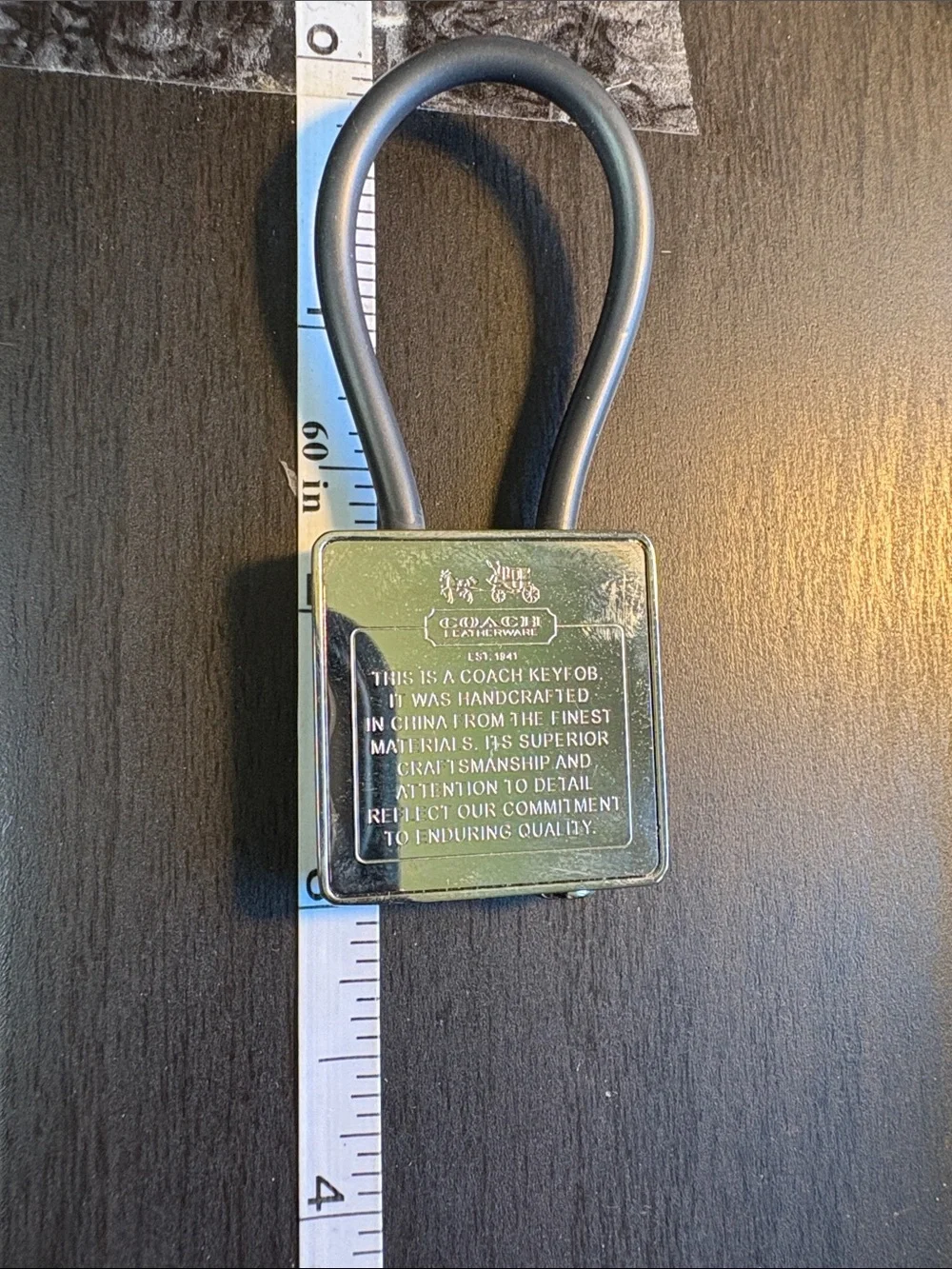 Coach Silver Creed Keychain with Black Pen.